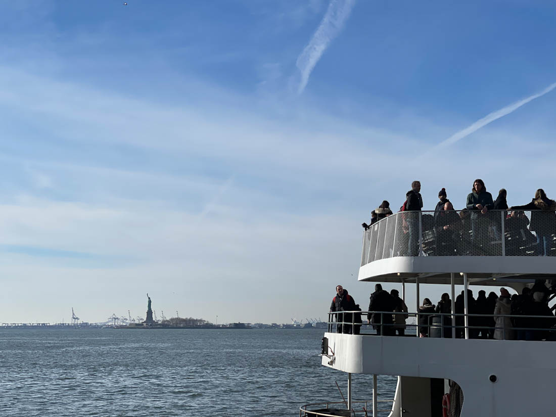 State City Cruises with Statue of Liberty in background 