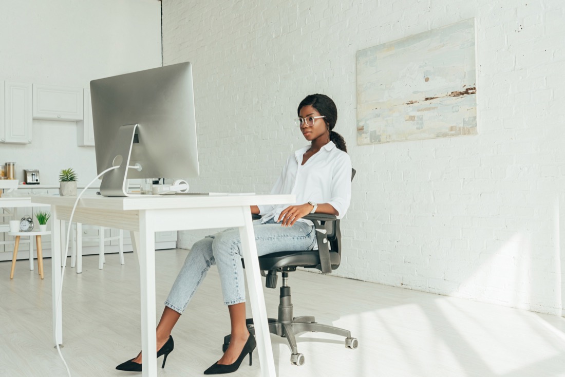 Woman in white office on desktop. Work.