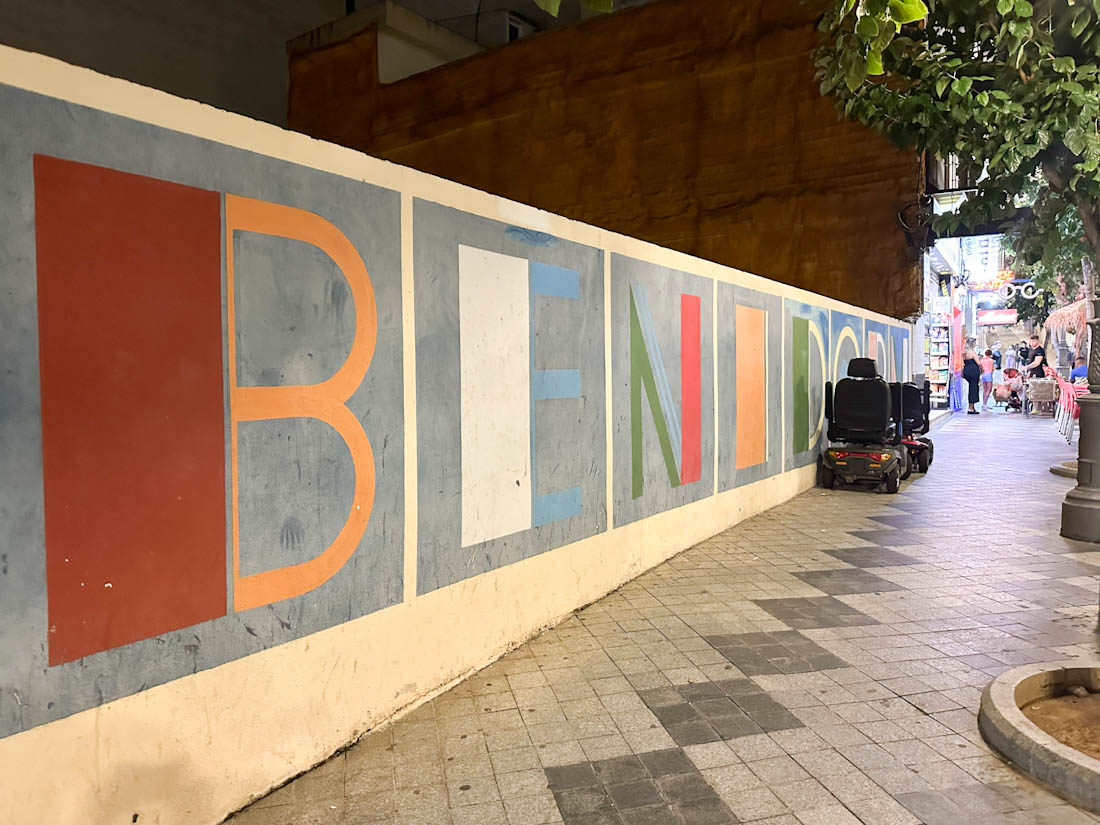 Street art on wall that says Benidorm 