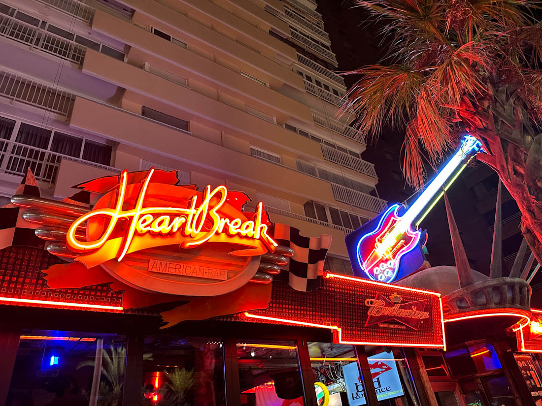 Bright sign of Heartbreak Hotel bar in Benidorm