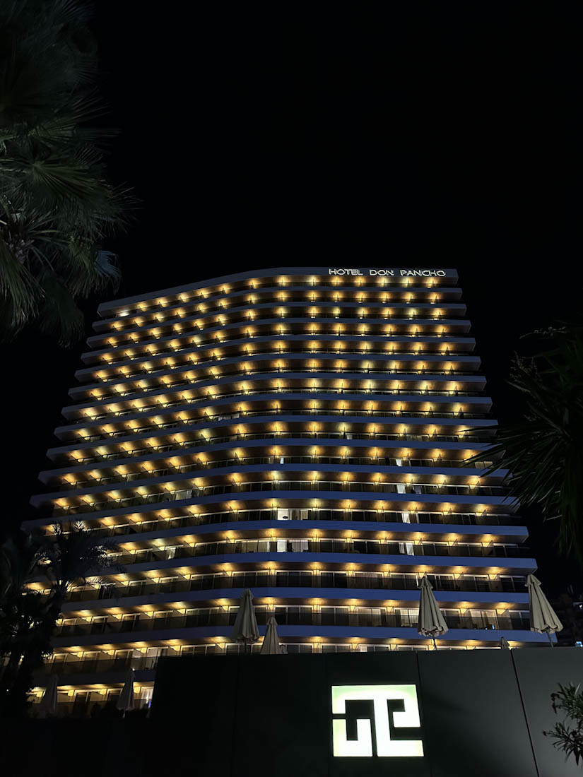 Hotel Don Pancho all lit up at night in Benidorm 