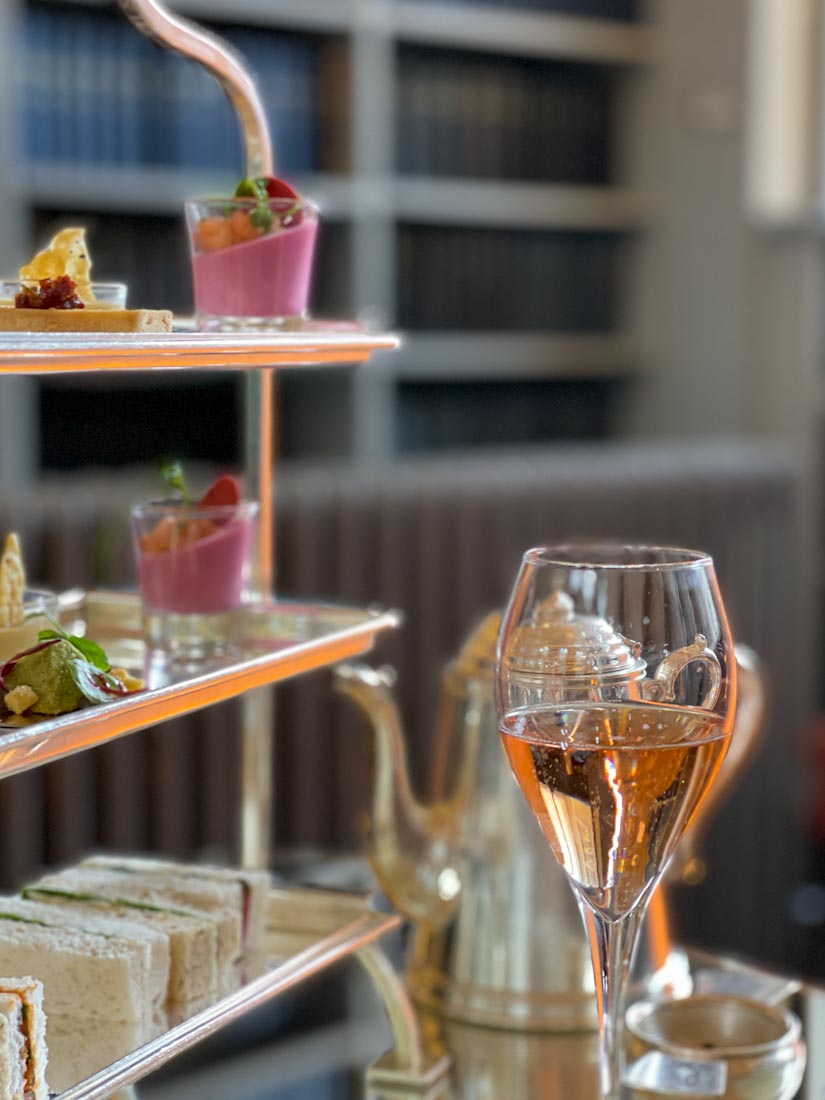 Afternoon tea trays with a glass of fizz