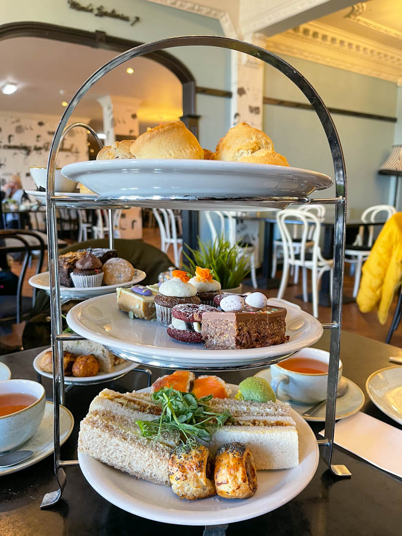 Afternoon tea trays with cakes and sandwiches